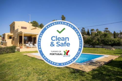 a sign for a clean and safe sign in front of a house at D05 - Amadeus Sunset Villa in Mato Porcas