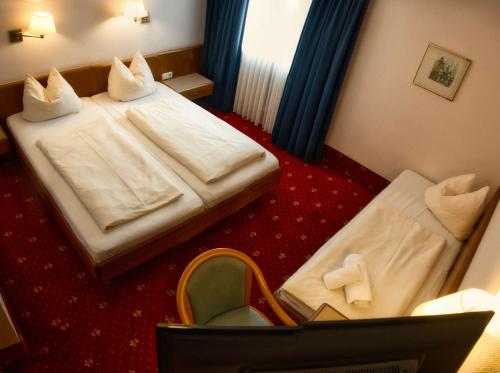 Katil atau katil-katil dalam bilik di Hotel Carmen