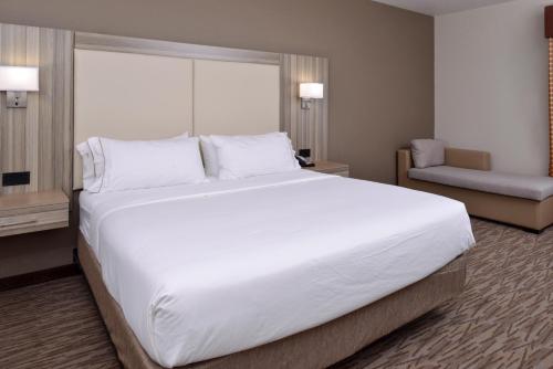 a large white bed in a hotel room at Holiday Inn Express & Suites Williams by IHG in Williams