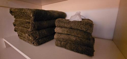 a group of three towels on a wall at DG Rosa María in Santiago del Estero