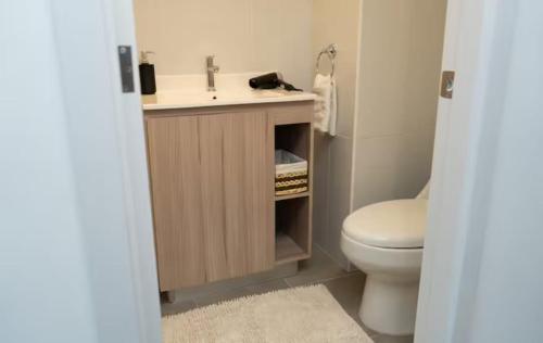 a bathroom with a sink and a toilet at Uleu Zona Viva in Guatemala