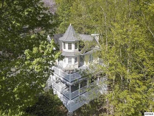 an overhead view of a white house in the trees at Ober Hideaway, Hot Tub, WIFI, 560 FREE tickets each paid day!!! in Gatlinburg