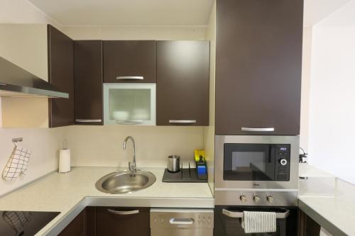 Η κουζίνα ή μικρή κουζίνα στο SunSet Mocan