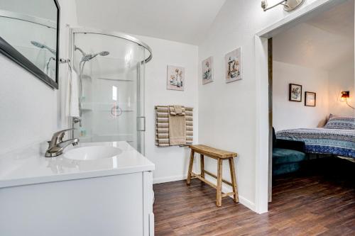 a bathroom with a sink and a shower and a bed at Cozy Country Living Cabin in SlidellandDecatur! in Decatur
