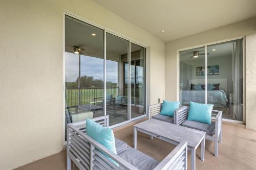 a patio with two benches and a table on a balcony at Champion gate townhome in Kissimmee