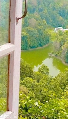 a view of a river from a window at Shanti kunj a unit of 'THE NOOK' Mangkhim in Aritar