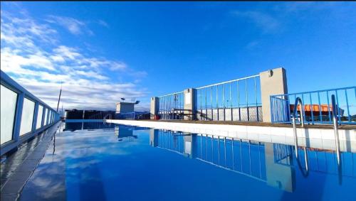 a pool of water in front of a building at 10 minutes to Karura forest Studios in thindigua Kiambu in Nairobi