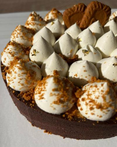a chocolate cake with marshmallows on a white plate at Affittacamere Gess in Montalto Uffugo