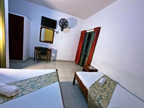 Ένα ή περισσότερα κρεβάτια σε δωμάτιο στο Hotel C Villa Plaza San Gil