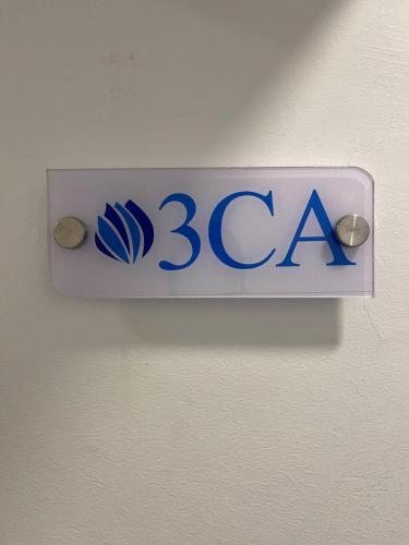 a sign for a bca sign on a wall at Modern, Comfortable, Close to Beaches in Colorado