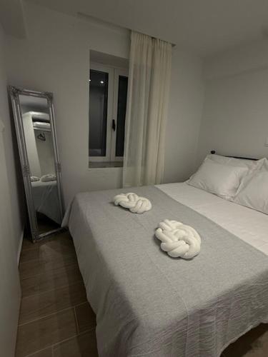 a bedroom with a bed with two towels on it at Nikis Hοuse in Elia Laconias