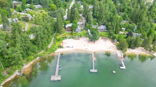 an aerial view of a lake with a dock at Custom Built Home on the Beach in Nelson