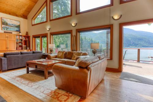 a living room with a couch and a table at Custom Built Home on the Beach in Nelson
