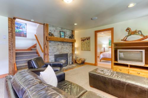 a living room with a couch and a fireplace at Custom Built Home on the Beach in Nelson