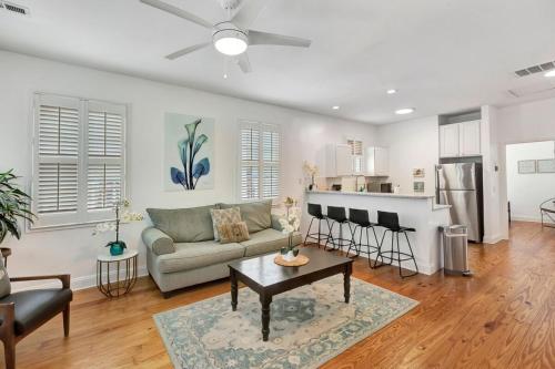 a living room with a couch and a table at Retreat on Spring, Unit B in Charleston