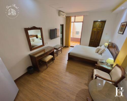Cama o camas de una habitación en El Gran Hotel de Pereira