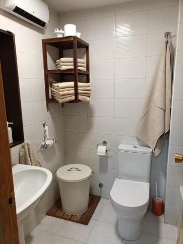 a bathroom with a toilet and a tub and a sink at PASEO DE LOS AYERBE Nº5 in Canfranc-Estación