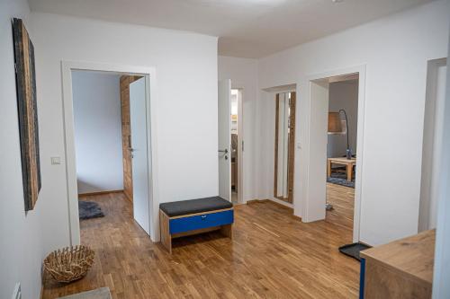 a room with white walls and a blue bench in it at Triebenstein Hideaway in Hohentauern