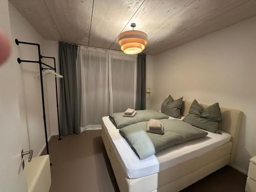 Katil atau katil-katil dalam bilik di Moderne Ferienwohnung in Aussichtslage