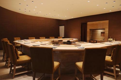 a large conference room with a large table and chairs at The St. Regis Bangkok in Bangkok