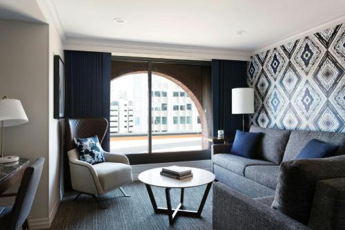 a living room with a couch and a table at Boston Marriott Long Wharf in Boston