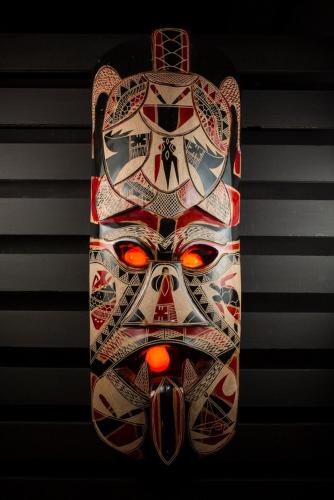 a skateboard with a picture of a mask on it at Funky Fish Beach & Surf Resort in Malolo