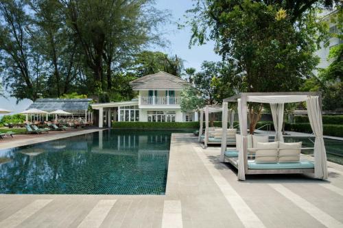 a house with a swimming pool with a gazebo at Lone Pine, Penang, a Tribute Portfolio Resort in Batu Ferringhi