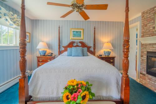 a bedroom with a bed with flowers on it at The Winstead Inn in Harwich