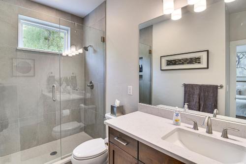 a bathroom with a toilet and a sink and a shower at Brand-New Townhome with Hot Tub, 4 Mi to Winter Park in Fraser