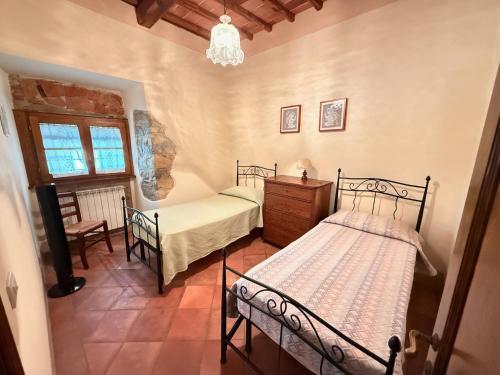 Ένα ή περισσότερα κρεβάτια σε δωμάτιο στο Casale delle Luci