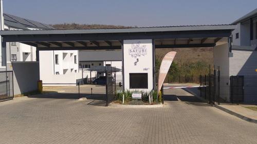 a building with a sign for a store at Luna Luxury Living in Nelspruit