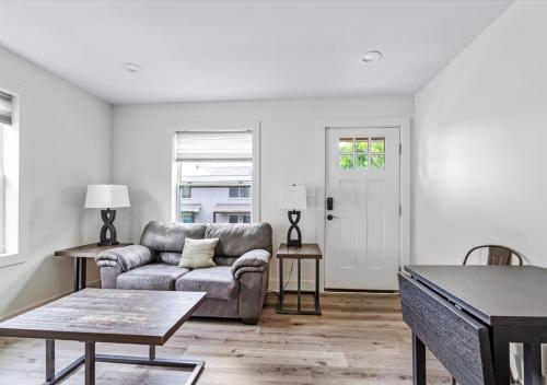 a living room with a couch and a table at 2BR Haven 306C Close to Charlottes Uptown in Charlotte