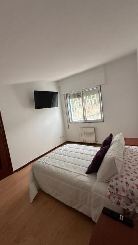 Postel nebo postele na pokoji v ubytování A Casa do Peregrino