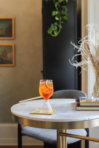 a wine glass sitting on top of a table at Heights House Hotel in Raleigh