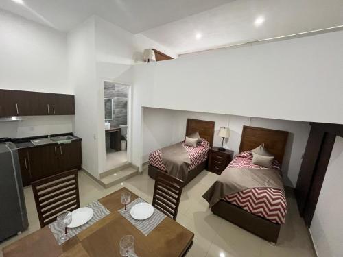 Postel nebo postele na pokoji v ubytování La casa de las palmeras
