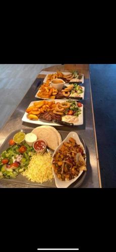 a buffet of different types of food on a table at Andreas Riverside Retreat at 7 Lakes Country Park in Crowle