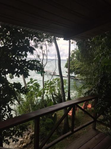 a view of the ocean from a porch at El Encantadero in Jobompiche