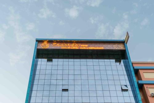 a building with a sign on the top of it at Appart Hôtel Golden Sky Home Café Restaurant & Spa in Beni Mellal