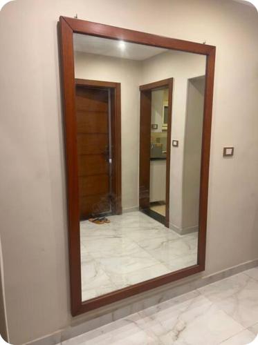 a mirror on a wall in a room at شقة فخمة للايجار in Cairo