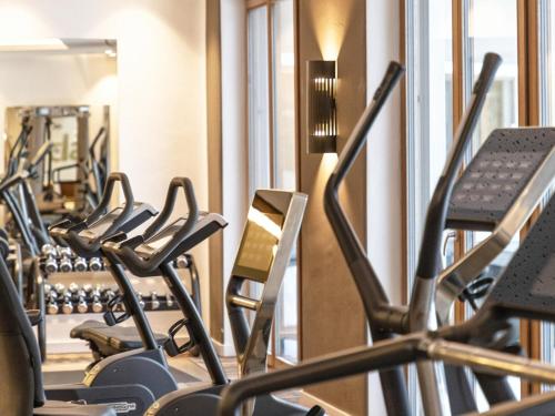 a row of exercise bikes in a gym at Stadtchalet Forsthaus in Kitzbühel