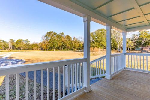 a porch with a view of a golf course at Edisto Island Oasis in Edisto Island