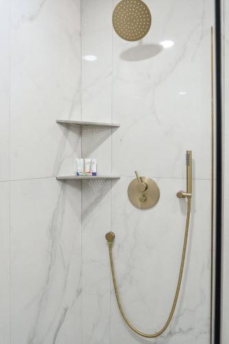 a shower with a glass door with a shower at Edisto Island Oasis in Edisto Island