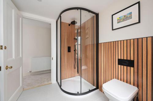 a bathroom with a shower and a toilet at Escape to Serene Georgian Estate, near Edinburgh in Ratho