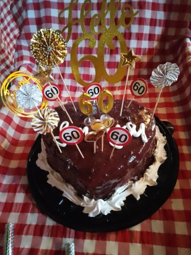 a chocolate birthday cake sitting on a table at Etno selo Srna in Kalna