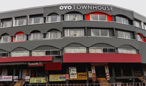 a building with aorenknife sign on top of it at Super Townhouse Gandhi Hall in Indore