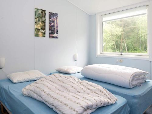 Ένα ή περισσότερα κρεβάτια σε δωμάτιο στο 20 person holiday home in Herning-By Traum
