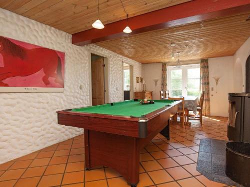 a living room with a pool table in it at Luxury Retreat with Pool - By Traum Ferienwohnungen in Thyholm