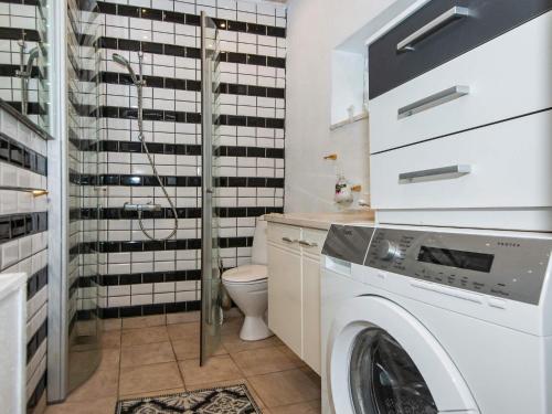 a laundry room with a washer and dryer at 4 person holiday home in Skærbæk-By Traum in Skærbæk