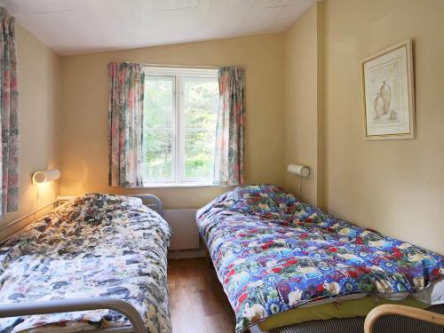 Ένα ή περισσότερα κρεβάτια σε δωμάτιο στο 4 person holiday home in Frederiksværk-By Traum