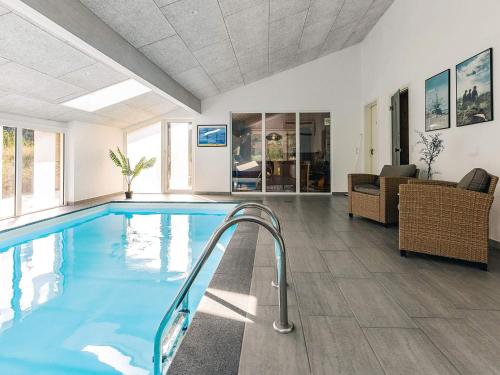 a large swimming pool in a living room at Luxury Retreat in Klitmoller - By Traum Ferienwohnungen in Torsted